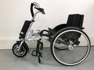 6. Firefly Electric Attachable Handcycle for Wheelchair © Rio Mobility 2020 Manual wheelchair with a propulsion assist device attached.