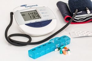Blood pressure cuff and pillbox