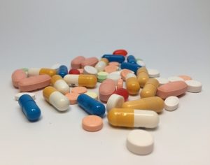 A pile of different pills and capsules.
