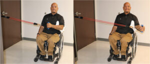 Man using resistive band to externally rotate the shoulder with elbow tucked against body.