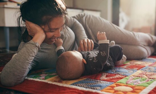 https://community.scireproject.com/wp-content/uploads/np_Smiling-mother-playing-with-her-baby-lying-on-the-floor_5oQQzb_free-1-e1673398977576.jpg